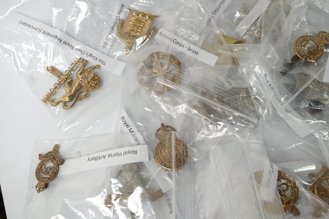 Forty military cap badges including; the Cambridgeshire regiment, Intelligence Corps, King’s Rifle Corps, Army Catering Corps, Small Arms School Corps, Duke of Wellington’s West Riding regiment, Royal Military College, R